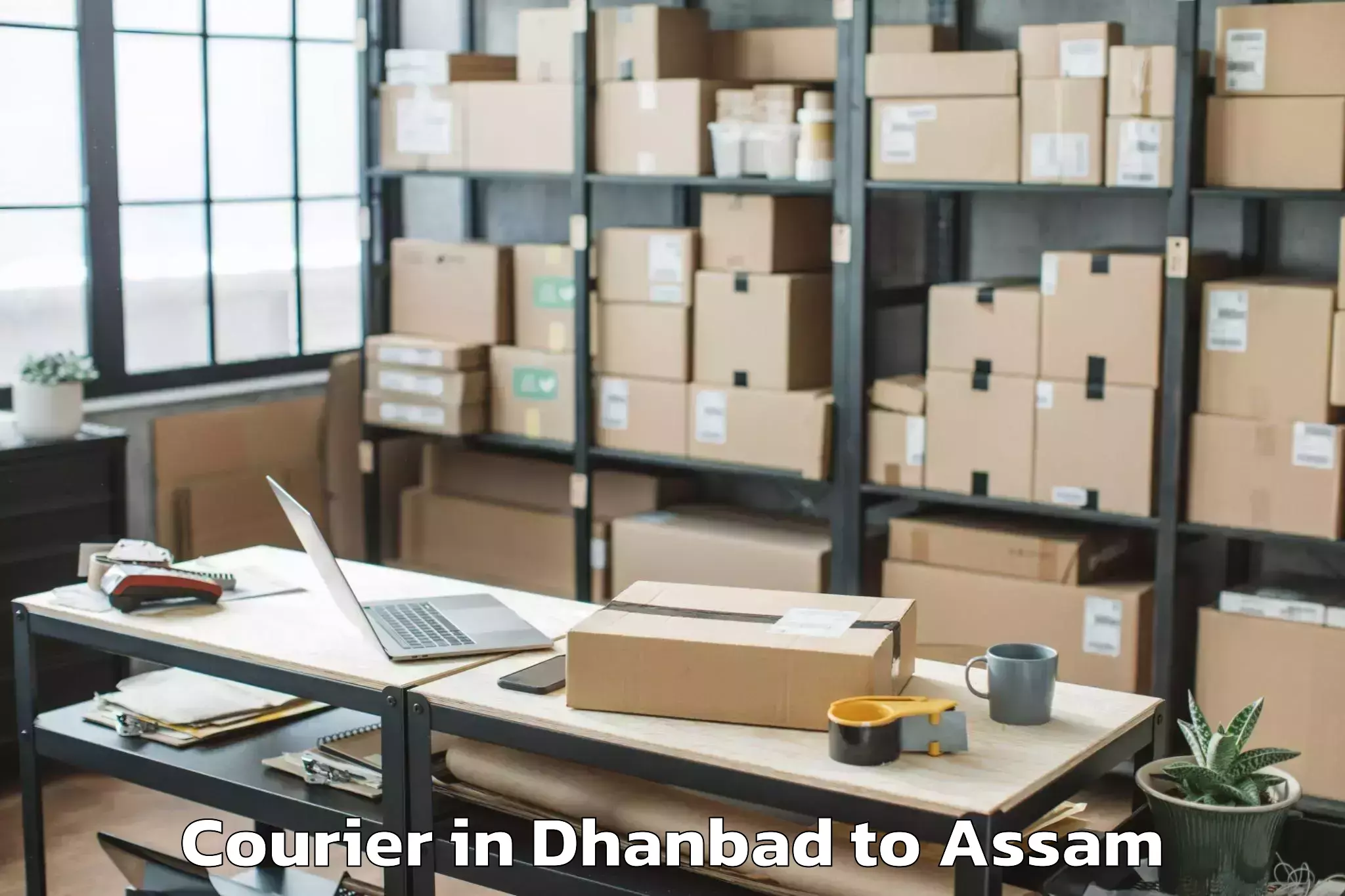 Quality Dhanbad to Muhimari Bilar Pathar Courier